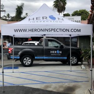 logo graphics on tent canopy and truck